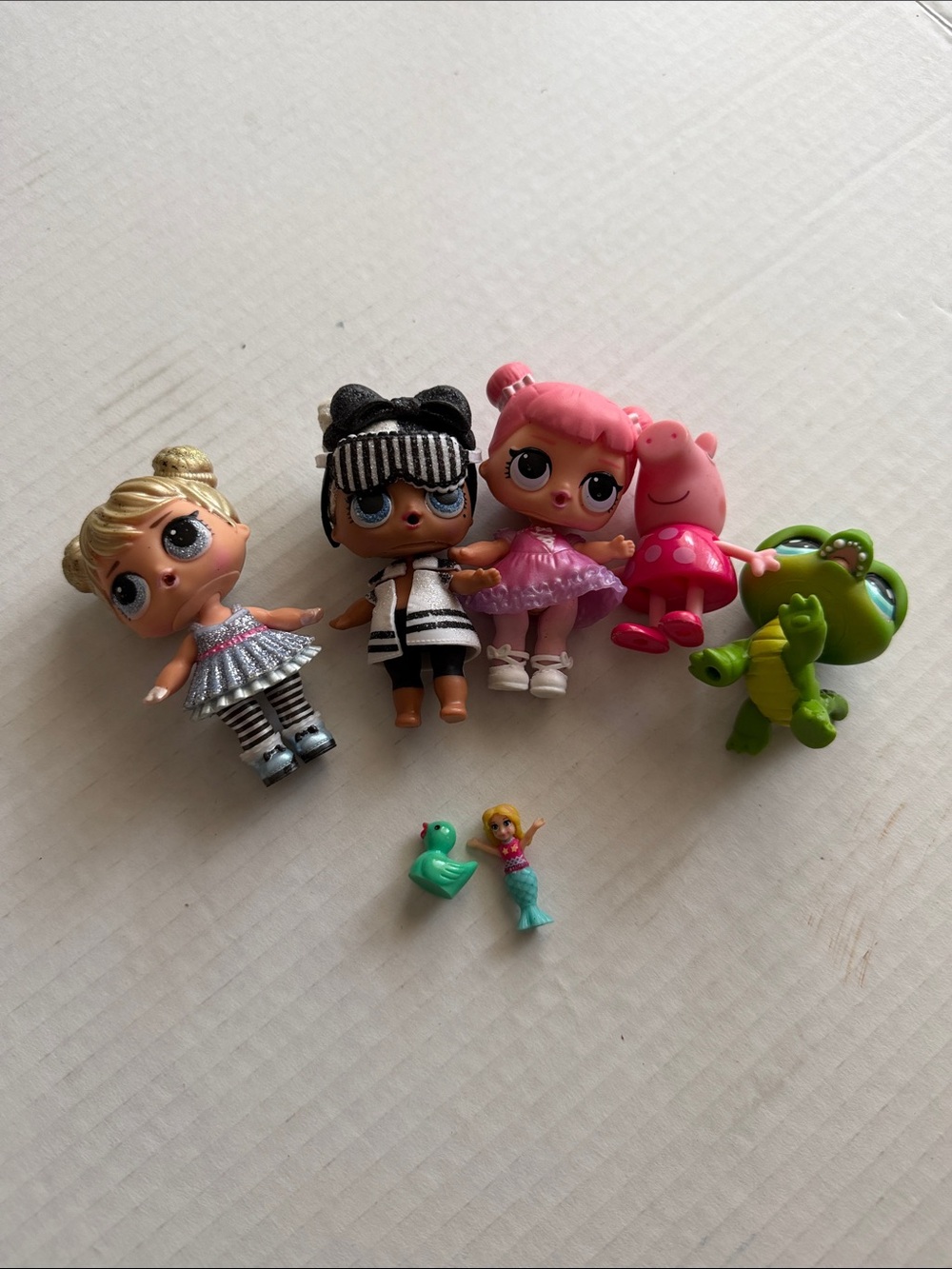 L.O.L. Surprise! Dolls Set with Pink, Black, Silver and Green Figures